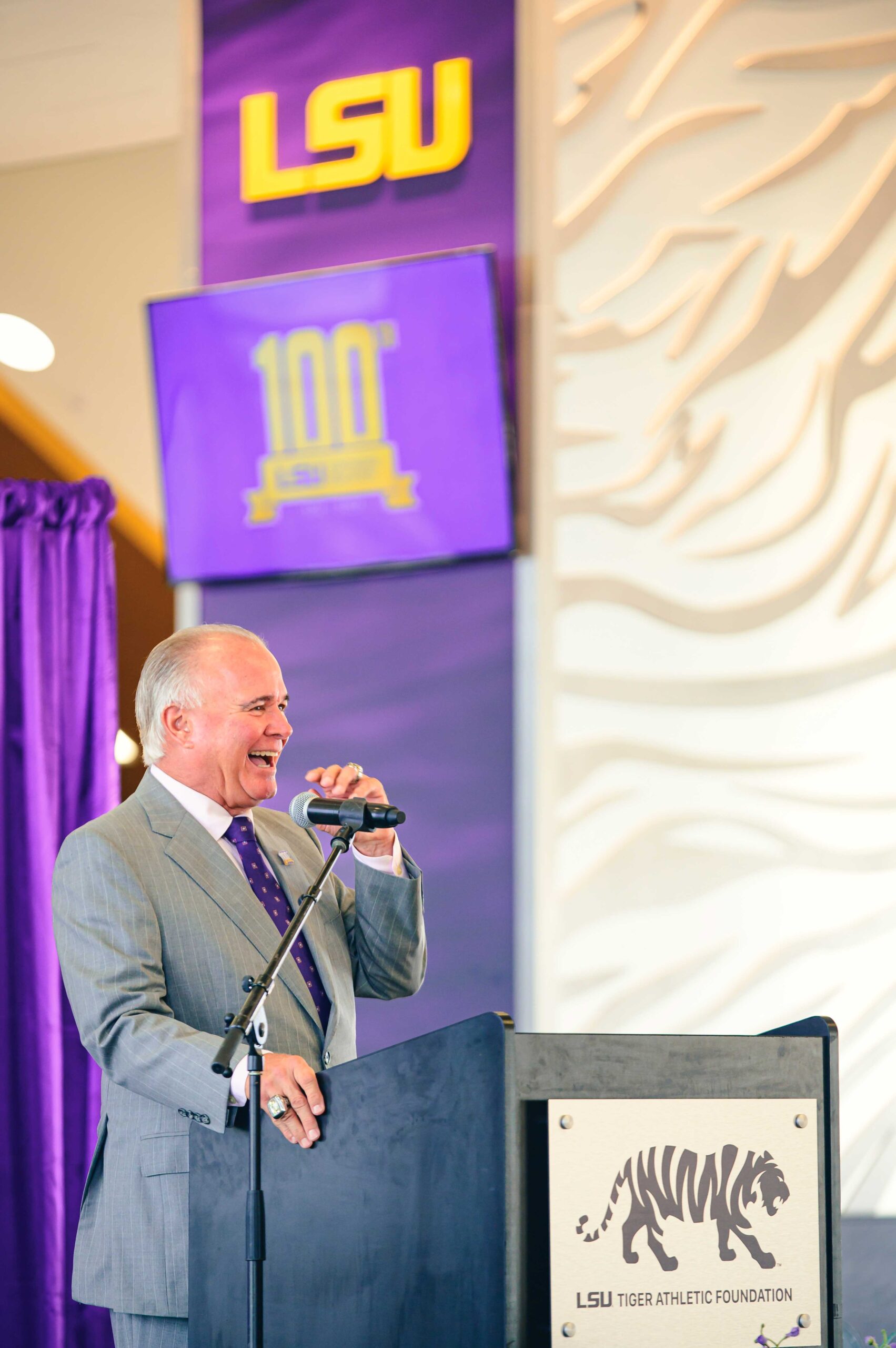 Former LSU Baseball Coach Paul Mainieri speaking at podium at the LSU Online & Continuing Education 100th Anniversary Party. Photo by: Rebecca Warren